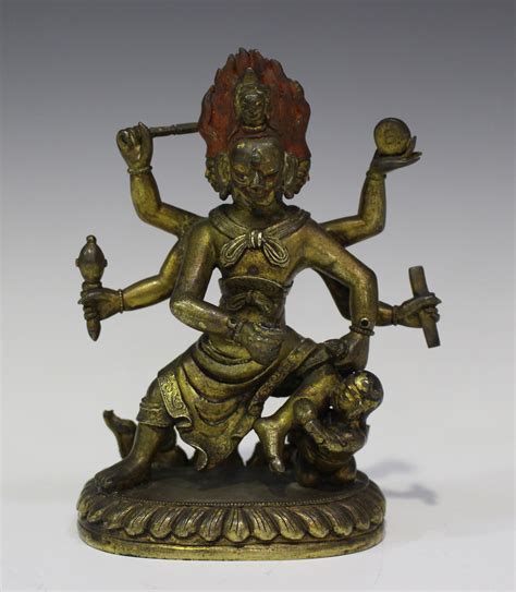 A Sino Tibetan Gilt Bronze Figure Of The Six Armed Mahakala Modelled