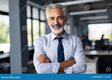 Happy Middle Aged Business Man Ceo Standing In Office Arms Crossed