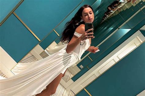 Irina Shayk Shares A Steamy Photo Wearing A Sheer White Mini Dress