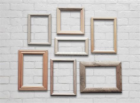 Frames on white wall stock image. Image of wood, border - 238703141