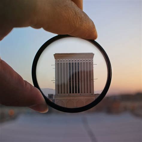 person holding magnifying glass  stock photo