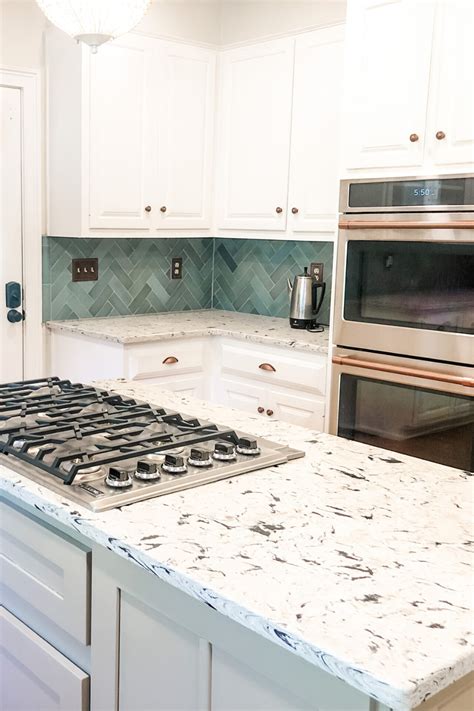 Kitchen With Herringbone Blue Tile Backsplash