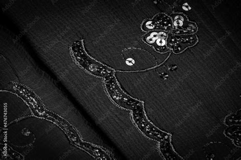 Silk black. The fabric is embellished with sequins. background, silk ...