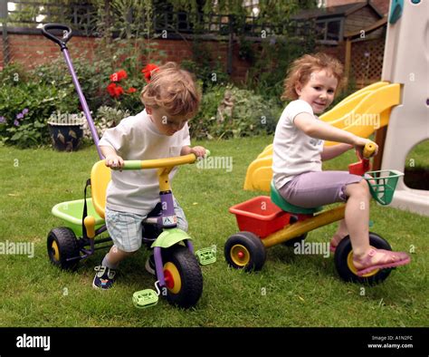 Boy Girl On Tricycles Hi Res Stock Photography And Images Alamy