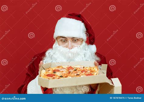 Closeup Portrait Of Santa Claus With Pizza Box In His Hands Looking At