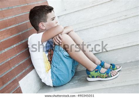 Sad Child Sitting On Stairs Stock Photo Edit Now 490345051