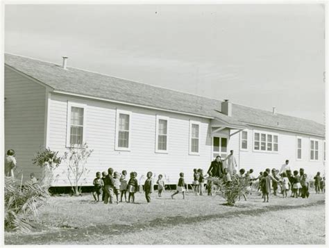 Children playing outside of nursery at Okeechobee migratory labor camps ...