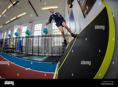 Secondary Education Wales Uk School Pupils In A Gymnasium Running On