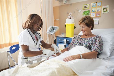 Nurse Preparing A Patient For An Iv Line Stock Image F0068873