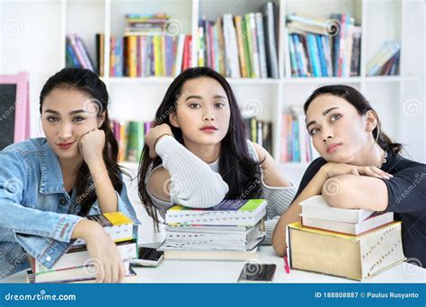 Group Of Teenage Girls Looking At Camera On Library Stock Image Image