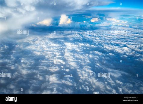 Looking Down Through The Clouds To Planet Earth Stock Photo Alamy