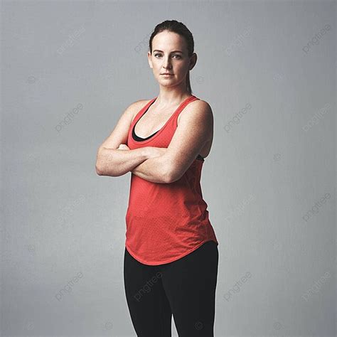 Athletic Woman In Studio Pose With Crossed Arms Photo Background And ...