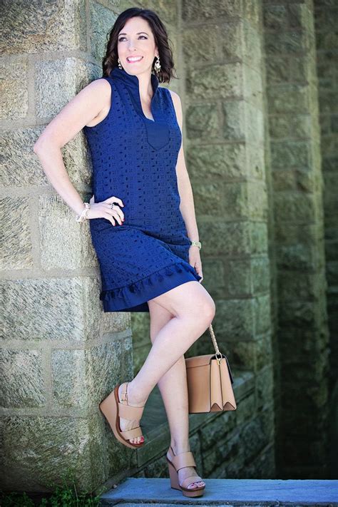 Jo Lynne Shane Wearing A Navy Mandarin Collar Shift Dress With Nude