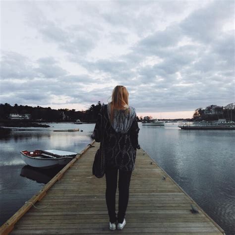 Premium Photo Rear View Of Woman Standing On Pier Over Lake