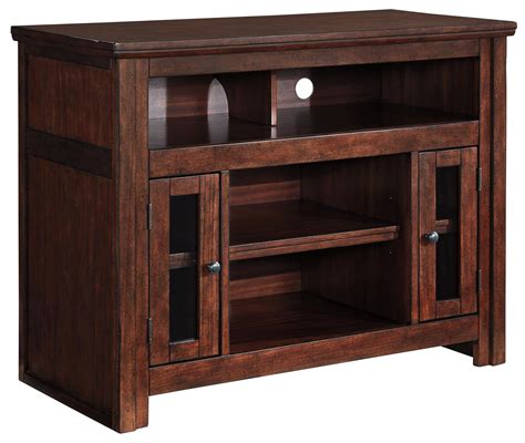 Signature Design By Ashley Harpan Mango Veneer Tv Stand With Glass Doors Value City Furniture