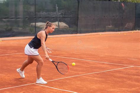 Outside On The Clay Court Female Tennis Player Very Beautiful Hitting