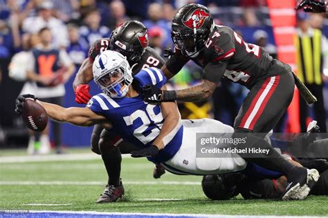 Jonathan Taylor Of The Indianapolis Colts Reaches With The Ball For A