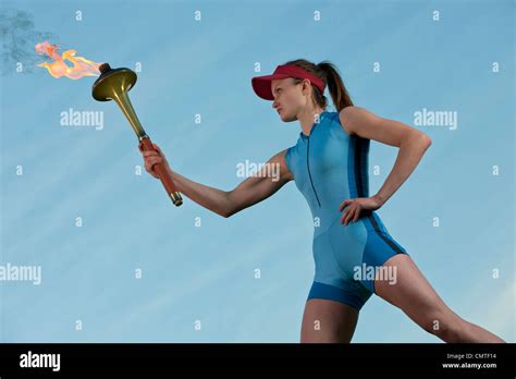 Caucasian Athlete Holding Olympic Torch Stock Photo Alamy