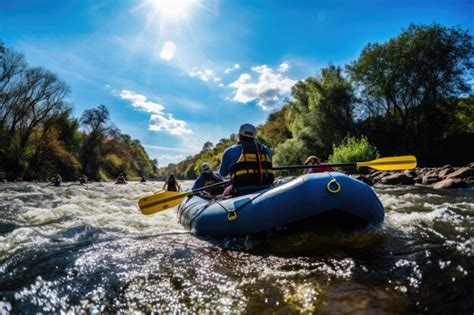 Premium Photo A Group Of People Riding In A Raft Down A River