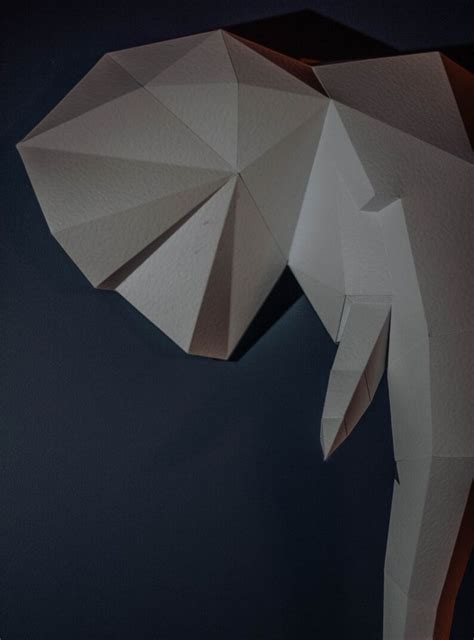 An Origami Elephant Is Shown In The Dark