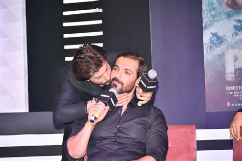 Shah Rukh Khan Surprises John Abraham With A Peck On His Cheek And We