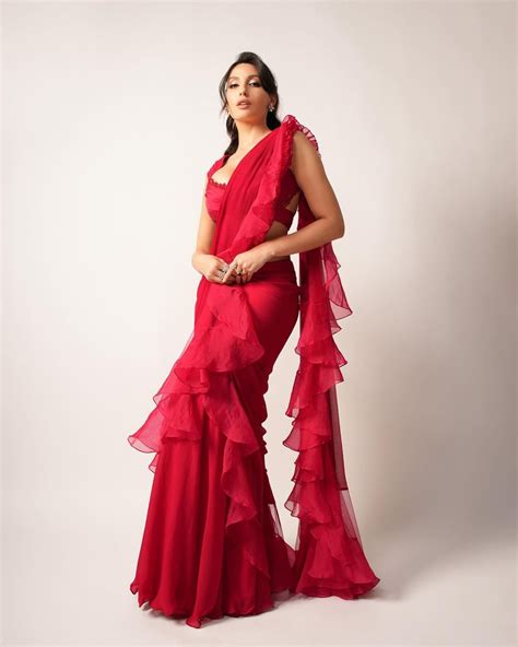 Bollywood Actress And Dancer Nora Fatehi Killer Look In Red Ruffle