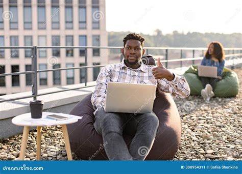 African American Male Freelancer Using Portable Computer Stock Image