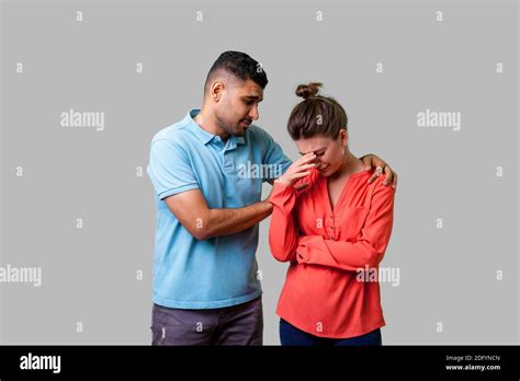 Unhappy Couple Man Woman Comforting Hi Res Stock Photography And Images