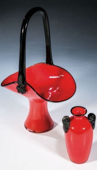 Two Red Vases Sitting Next To Each Other