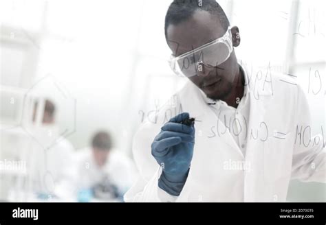 Scientist Writing Chemical Formula On A Glass Board Stock Photo Alamy