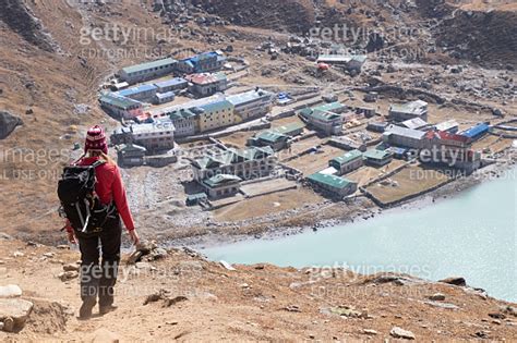 Female Tourist Hikking At Gokyo Ri Mountain Peak Near Gokyo Lake During