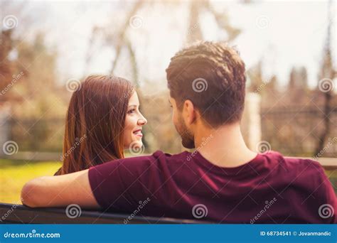 Two Lovers Sitting On A Bench In A Park Stock Image Image Of Feeling