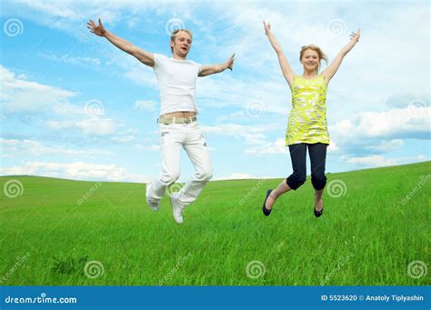 Young Couple Jump Stock Photo Image Of Clouds Portrait 5523620