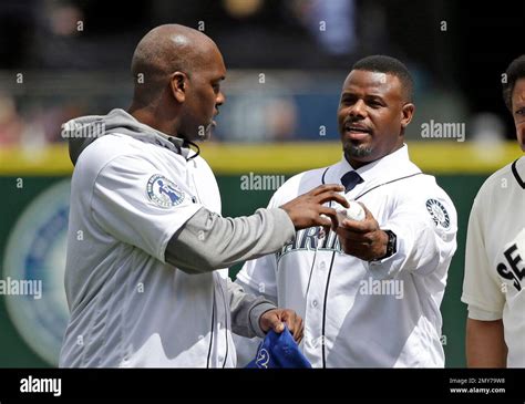 Former Seattle Mariners Outfielder Ken Griffey Jr Right Hands A Ball To Former Seattle