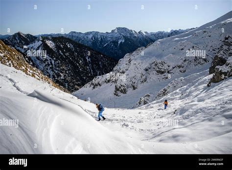 Climbers In The Snow Hiking Trail In Winter Path To Ammergauer