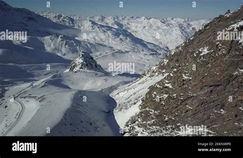 Ski Descent Of Val Thorens Ski Resort Next To Jagged Rocky Mountain