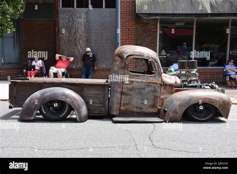 A vintage Pickup Truck built up as a Rat Rod on display at a car show ...