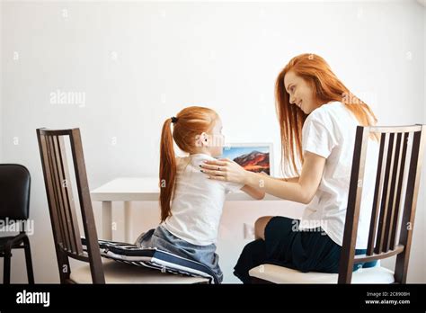 Happy Redheaded Mother And Daughter Spending Time Together Mom Helps