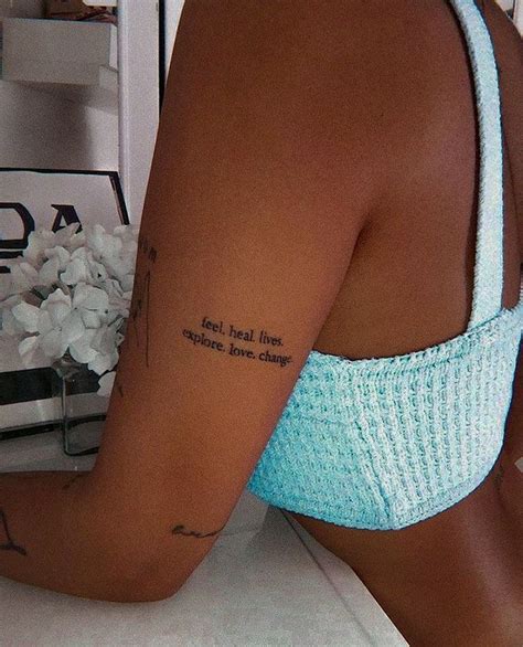 A Woman With A Tattoo On Her Left Arm And The Words For Real Love Are