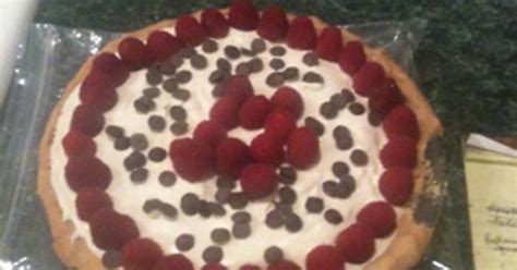 Ice Cream Pie With Home Made Honey Vanilla Ice Cream Topped With Rasberries And Chocolate