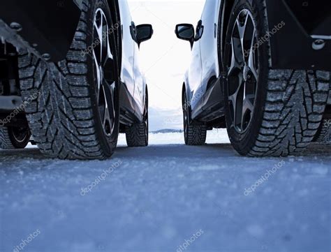 Studded winter tires against studless winter tires — Stock Photo ...