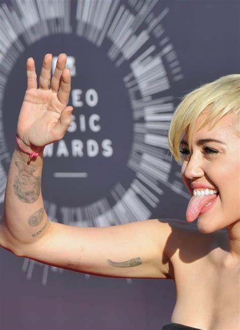 Miley Cyrus' Tattoos and What They Mean