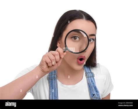 Curious Young Woman Looking Through Magnifier Glass On White Background