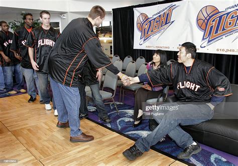 Chinese basketball player Sun Ming Ming shakes hands with his... News Photo - Getty Images