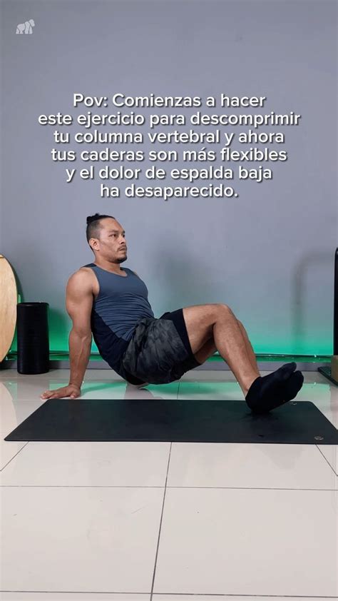 A Man Sitting On Top Of A Yoga Mat In Front Of A Wall With Words Above It