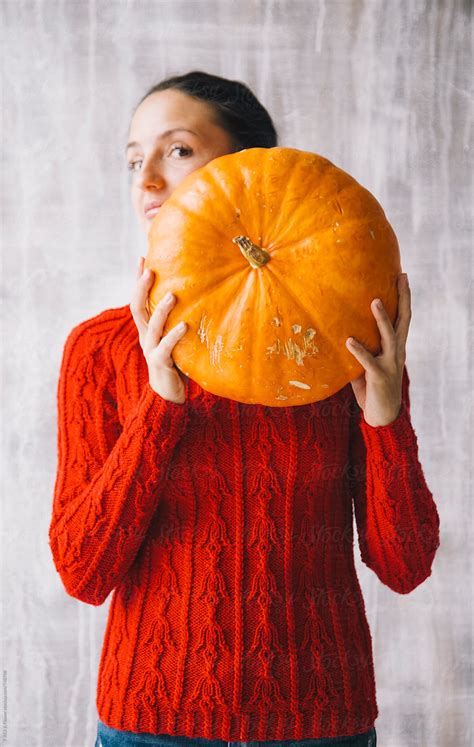 Woman Looking Out Of Pumpkin Del Colaborador De Stocksy Danil Nevsky