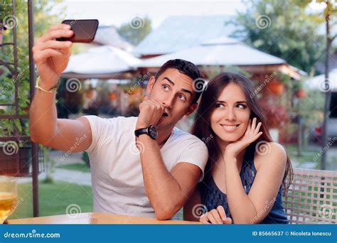 Romantic Couple On A Date At The Restaurant Taking A Selfie Stock Image