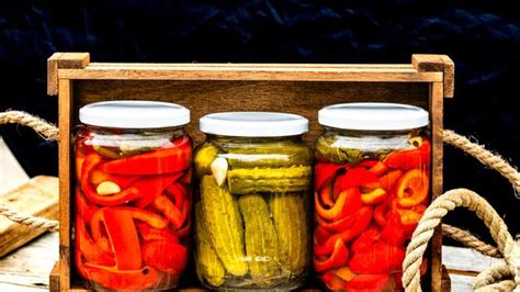 Premium Photo Wooden Crate With Glass Jars With Pickled Red Bell