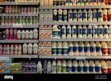 Dubai UAE December 2019 Milk bottles arranged on shelves for sale. Variety of sizes. Also ...