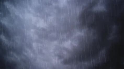 Heavy Rain Falling From Dramatic Sky With Dark Stormy White Clouds